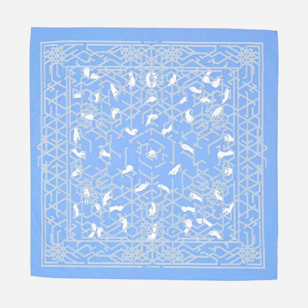  le bandana habile en coton upcyclé , fabriquer à paris , représente l'histoire de la création du monograme habile sur une toile de couleur marina (bleu claire) | marina
