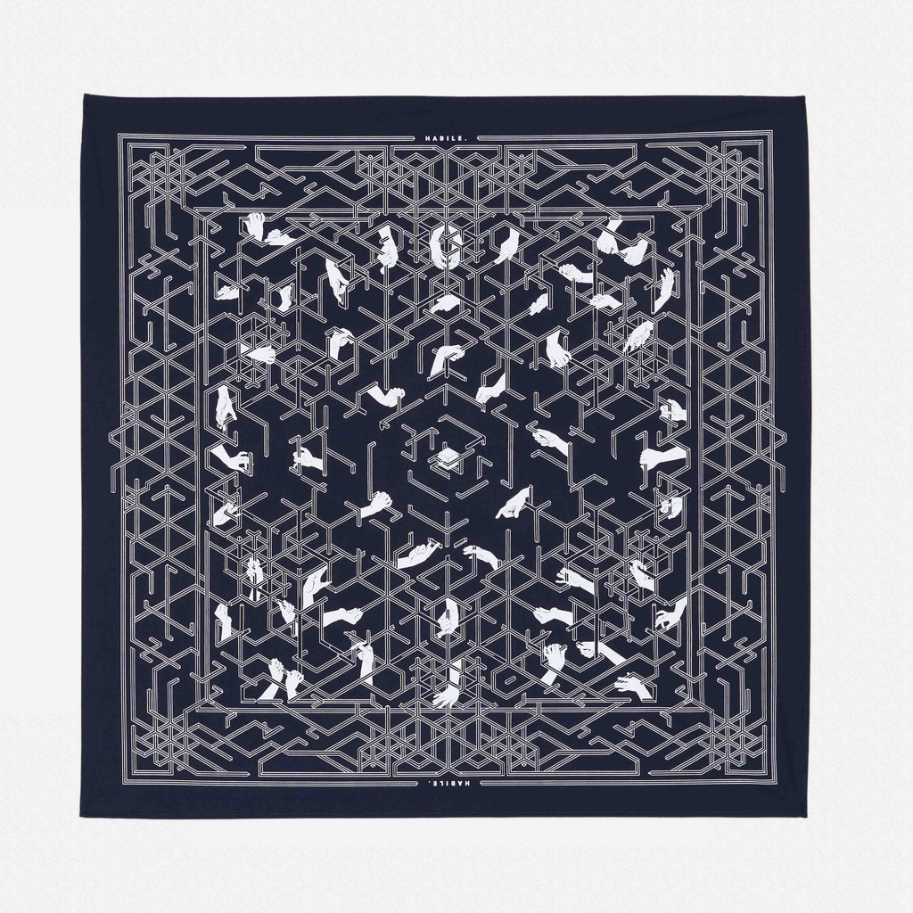  le bandana habile en coton upcyclé , fabriquer à paris , représente l'histoire de la création du monograme habile sur une toile de couleur outremer (bleu foncé) | outremer